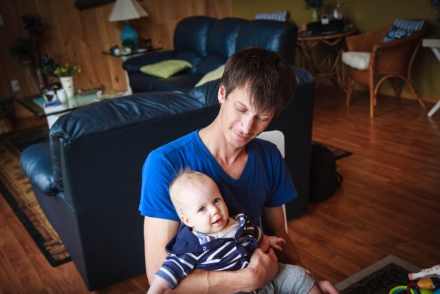 Sonja sitting on Uncle Matt's lap